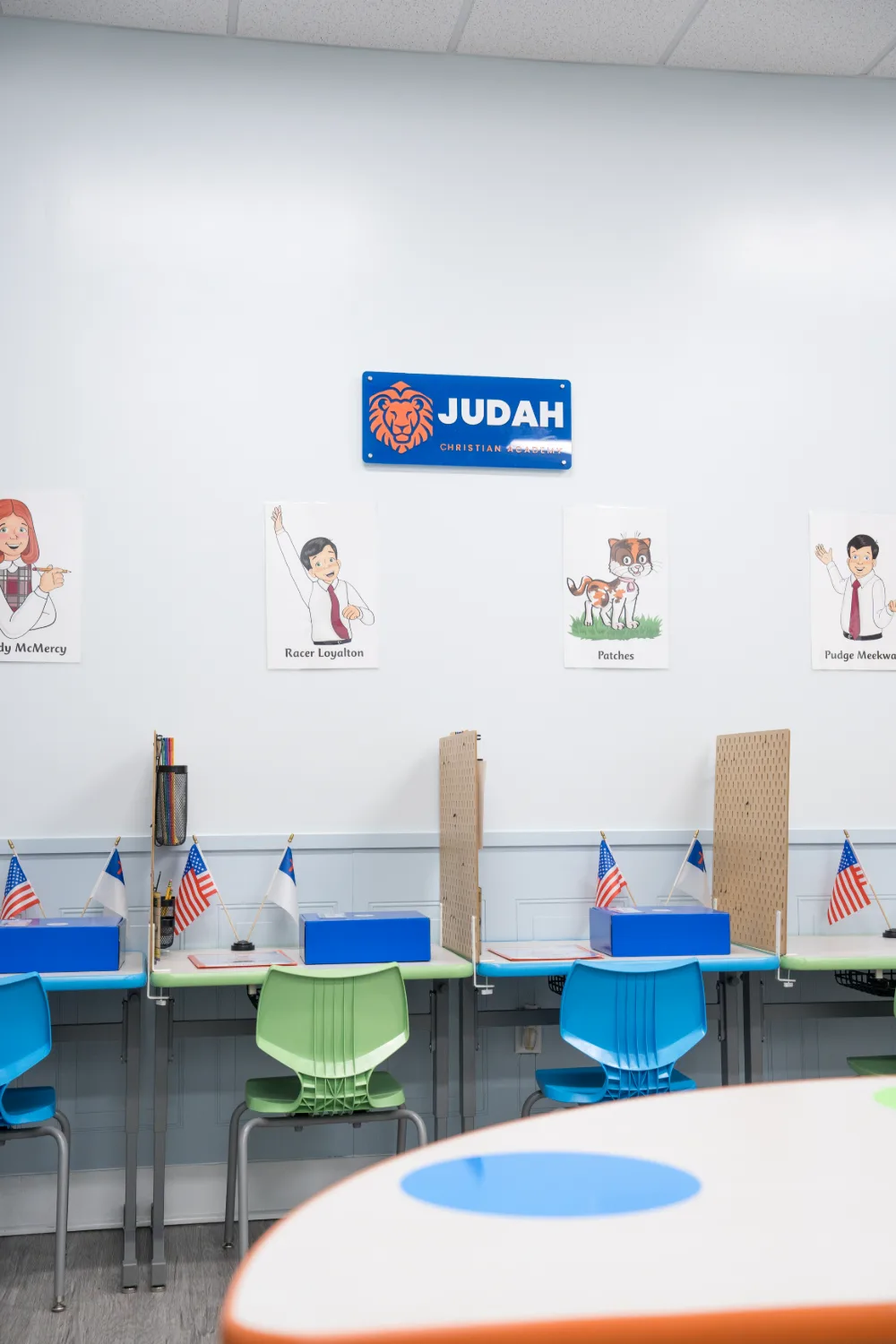 The Judah Christian Academy sign on a classroom wall above the study stations.