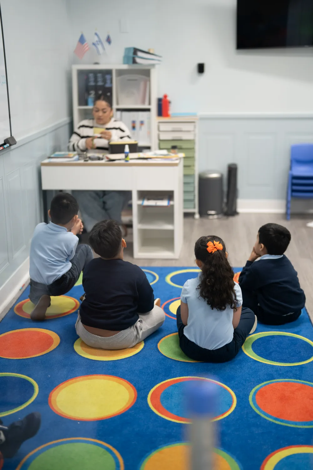Students working at their study stations in a Judah Christian Academy classroom, with a teacher at the desk.
