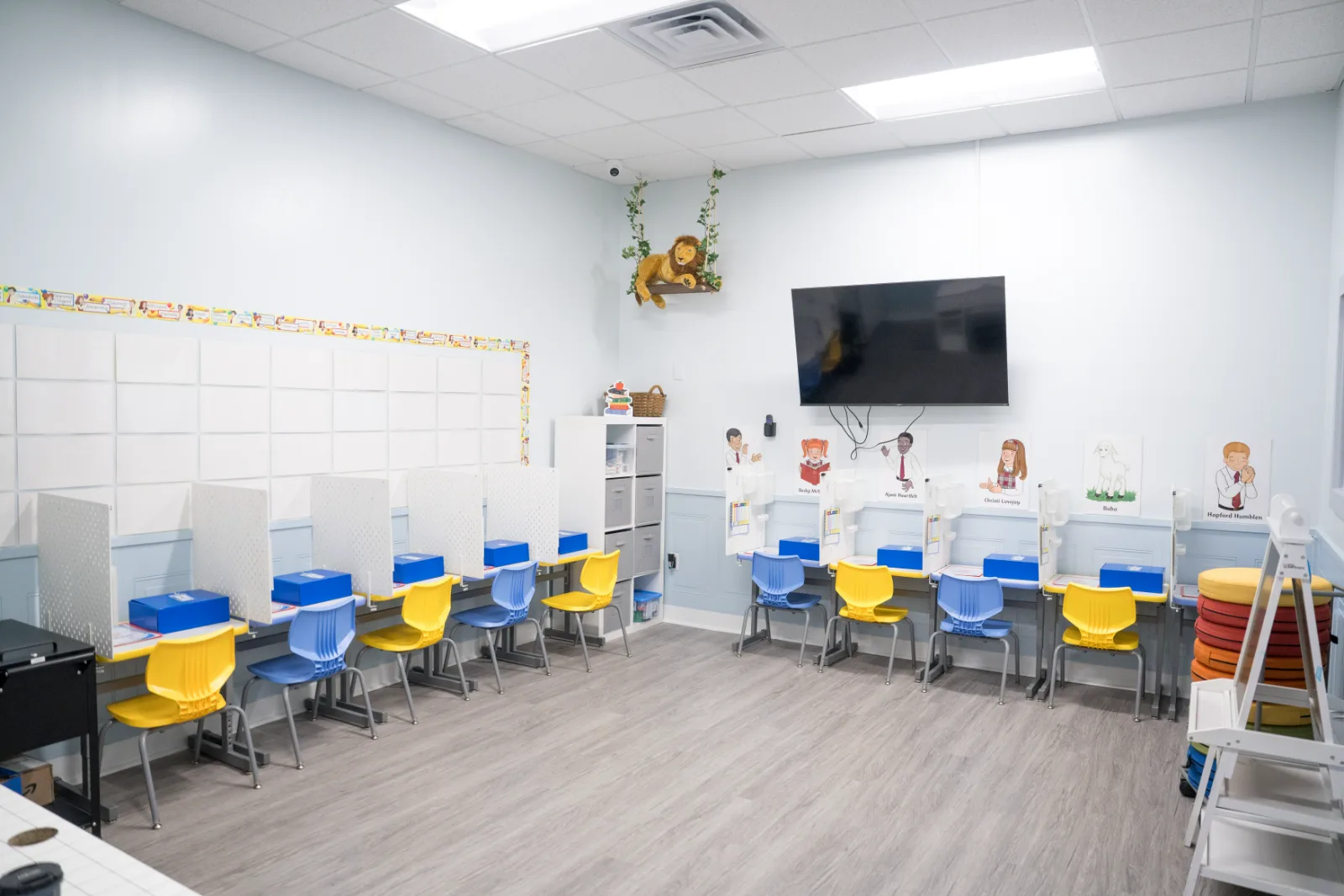 A row of individual study stations along a Judah Christian Academy classroom wall.