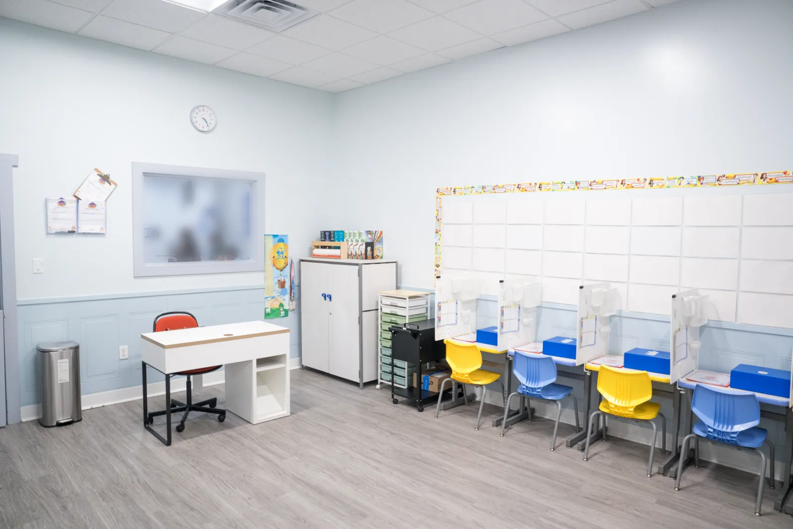Individual study stations and a teaching desk in a Judah Christian Academy classroom.