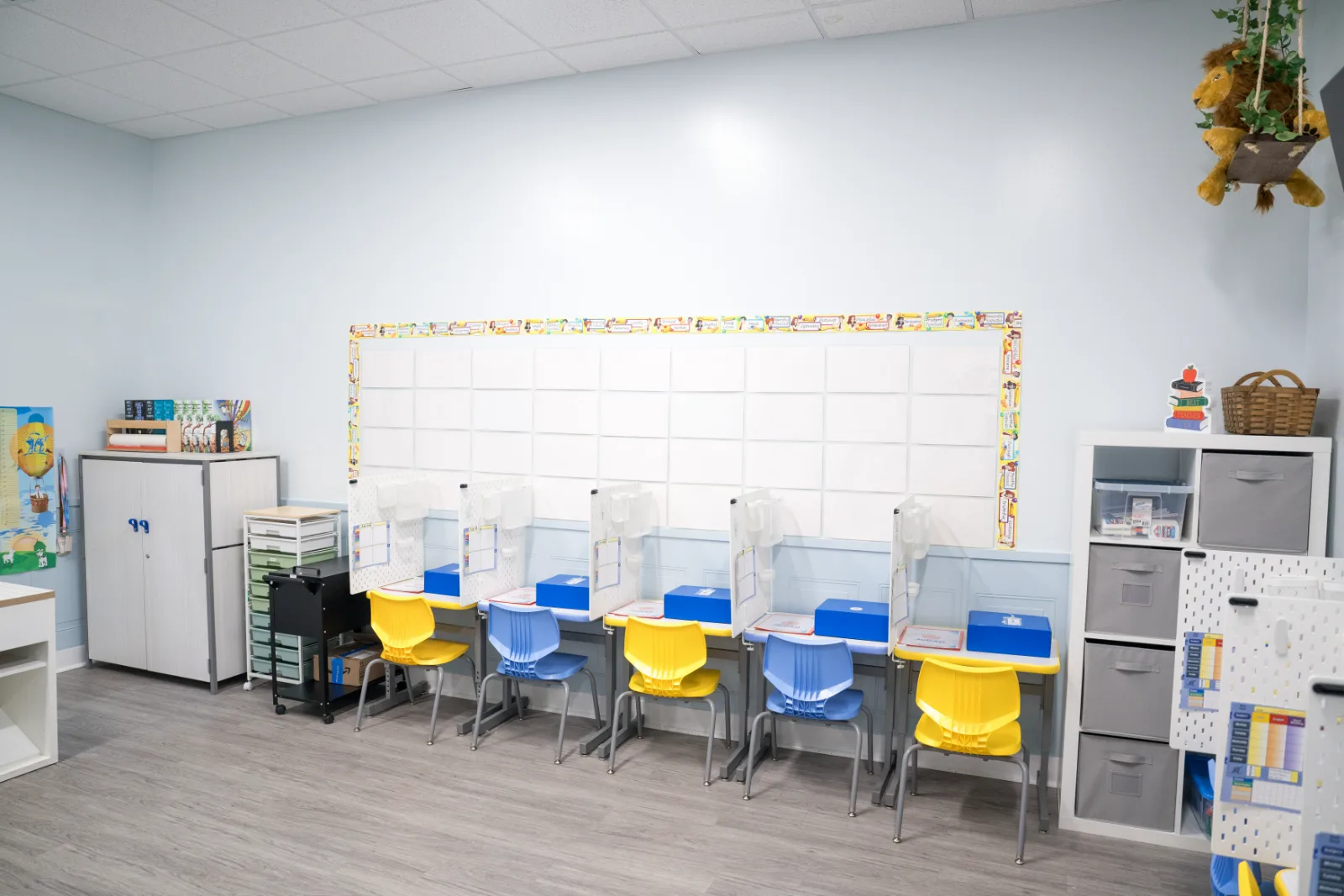 A long row of individual study stations in a Judah Christian Academy classroom.