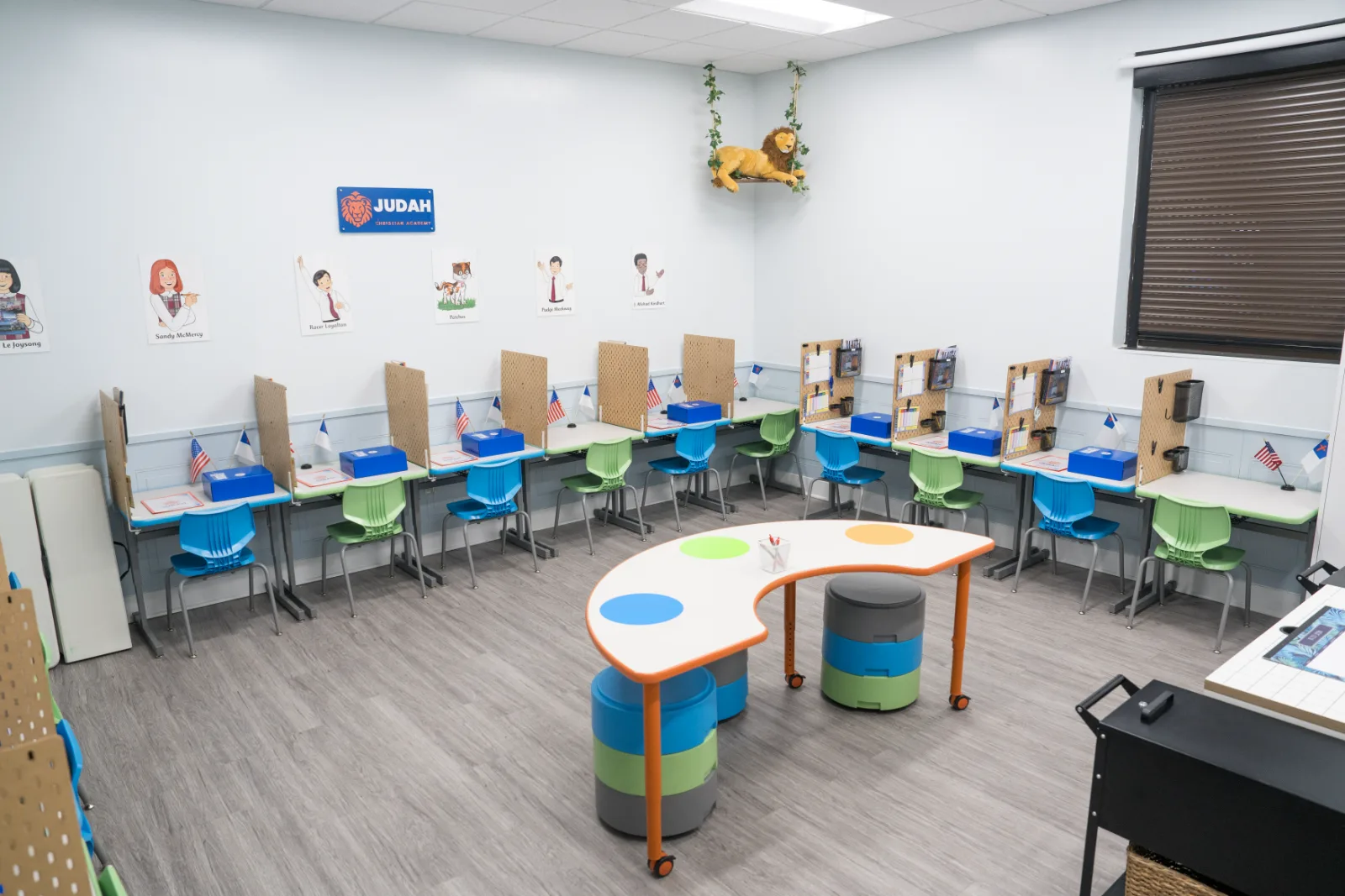 A Judah Christian Academy classroom with rows of individual study stations and the academy sign on the wall.