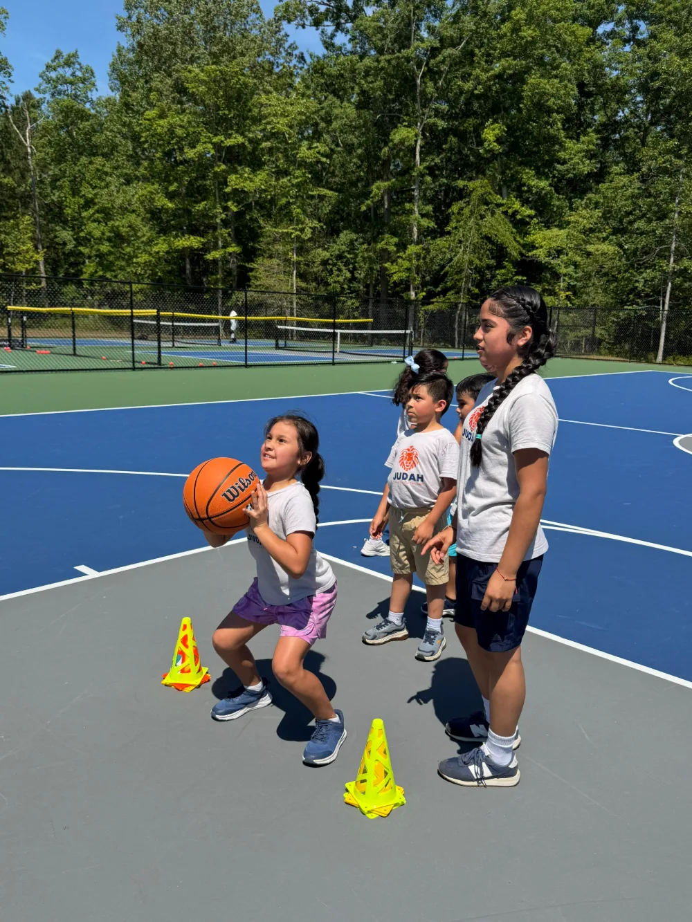 Students gathered on the outdoor sports court.