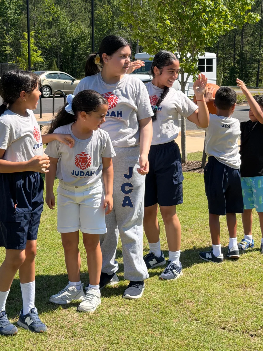 Students together outdoors during an activity day.