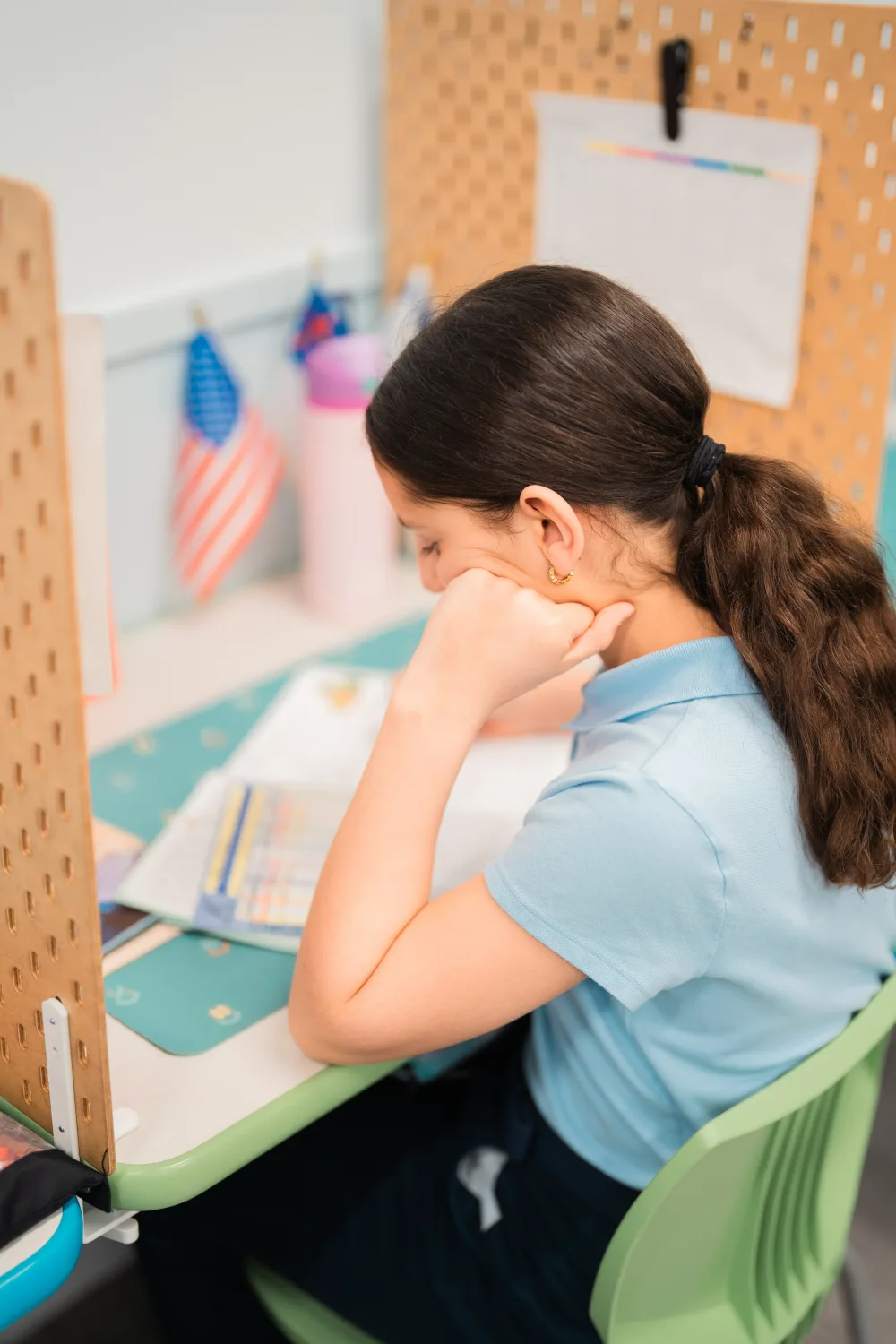 A student working at their individual study station.