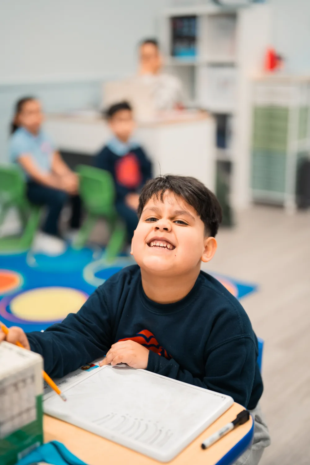 A Judah Christian Academy student smiling at the camera.