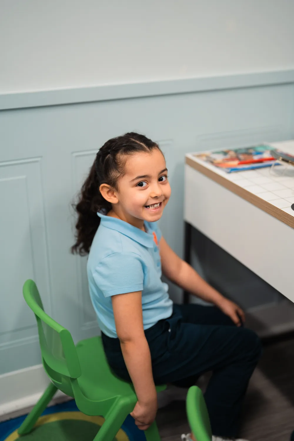 A Judah Christian Academy student in the light blue daily uniform polo.