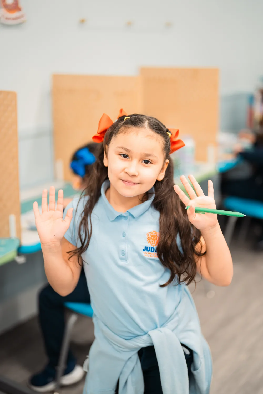 A Judah Christian Academy student in the light blue daily uniform polo.